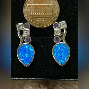 Lab created Opal earrings set in Rhodium plated sterling silver NWOT